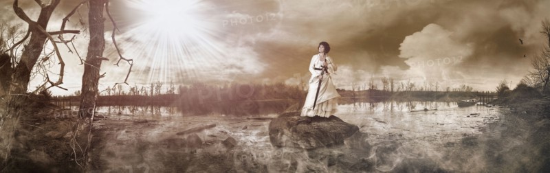 Caucasian woman standing on rock in remote lake