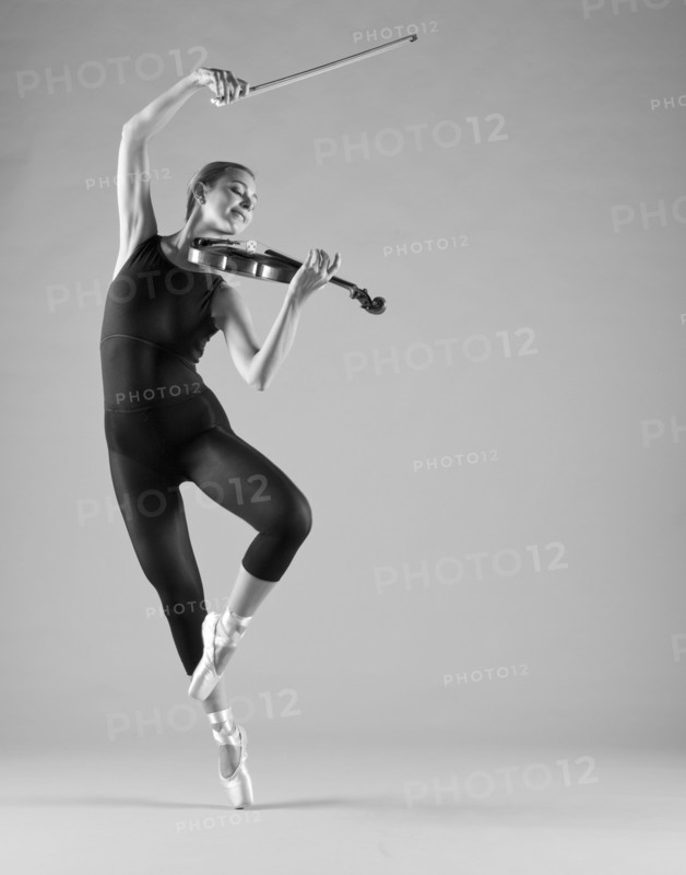 Caucasian ballet dancer playing violin