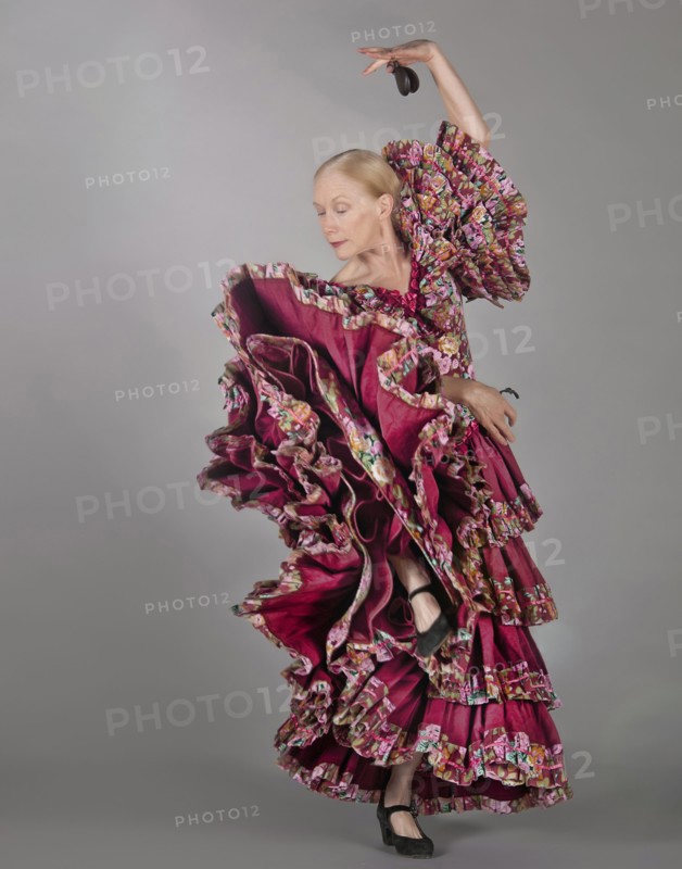 Caucasian woman dancing in ornate dress