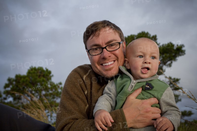Portrait of smiling Caucasian father holding baby son