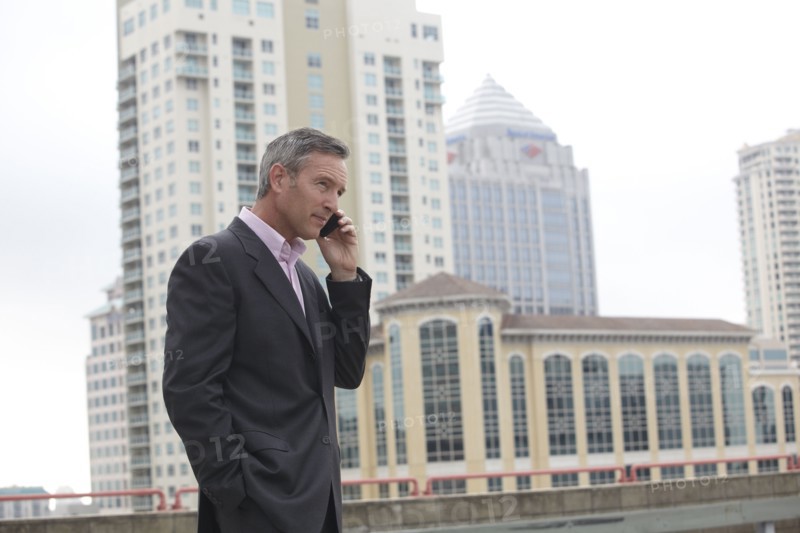 Caucasian businessman talking on cell phone