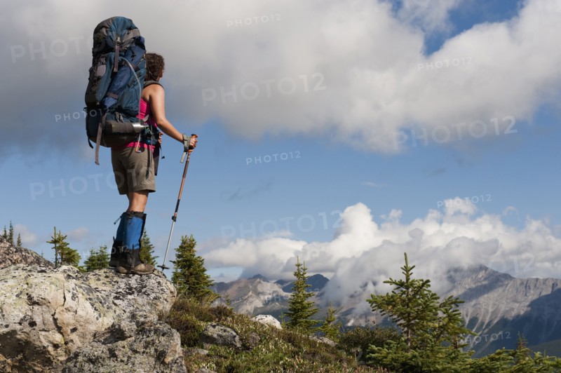 Hispanic woman hiking near mountain