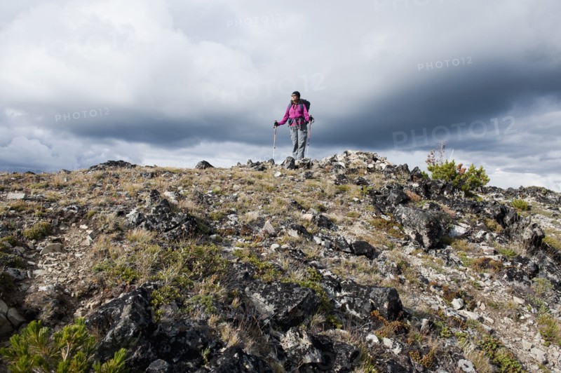 Hispanic woman hiking on mountain