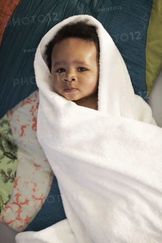 African American baby wrapped in towel