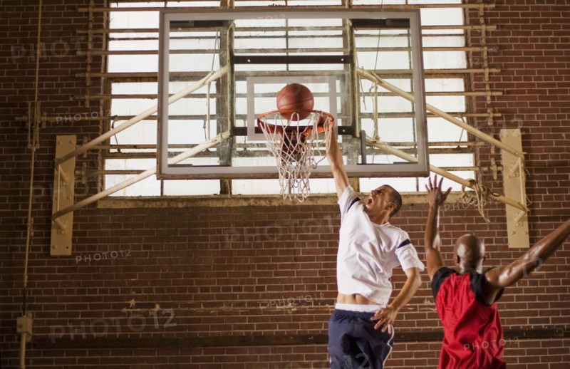 Men playing basketball