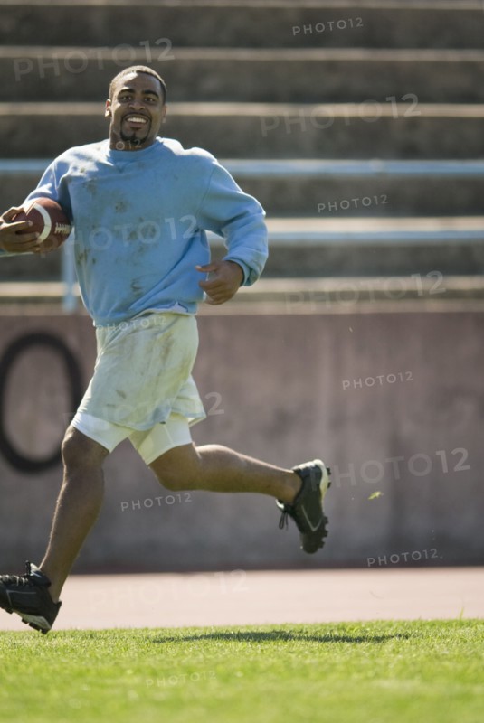 Man running with football