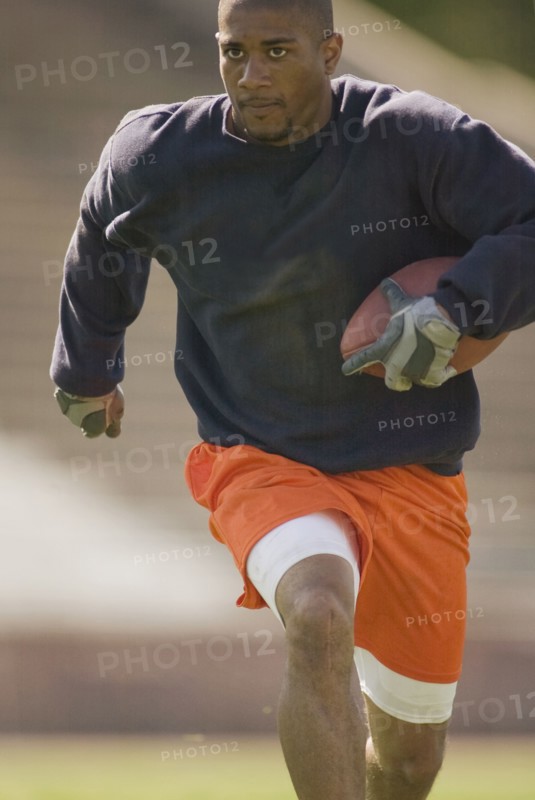 Man running with football