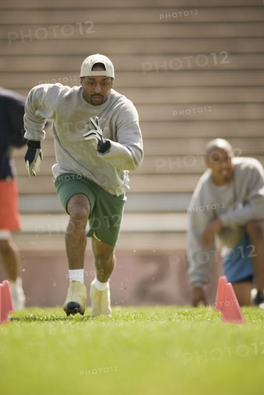 Men training on football field