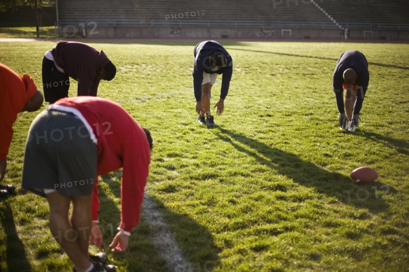 Men training on football field