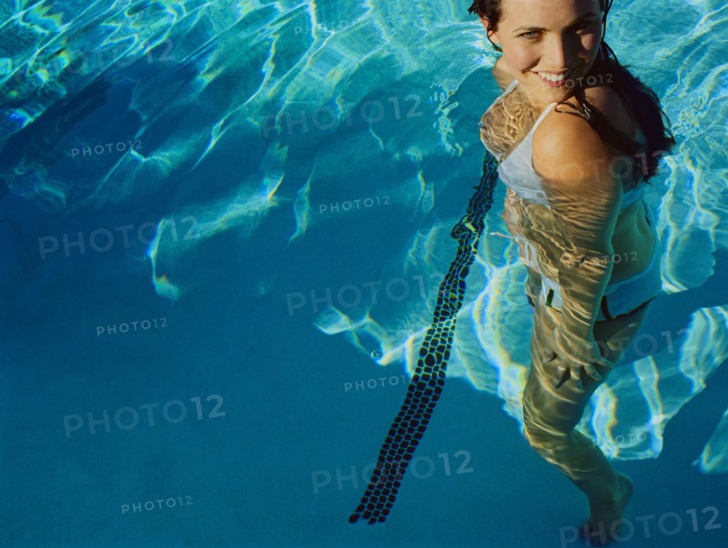 Woman standing in swimming pool