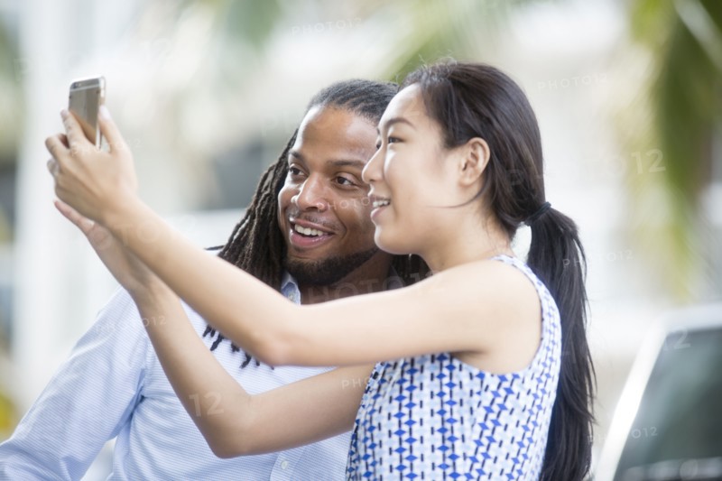 Business people taking selfie outdoors