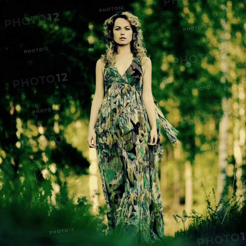 Caucasian woman walking in grass