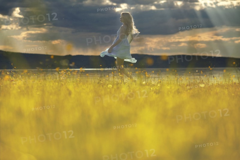 Caucasian woman walking in rural field