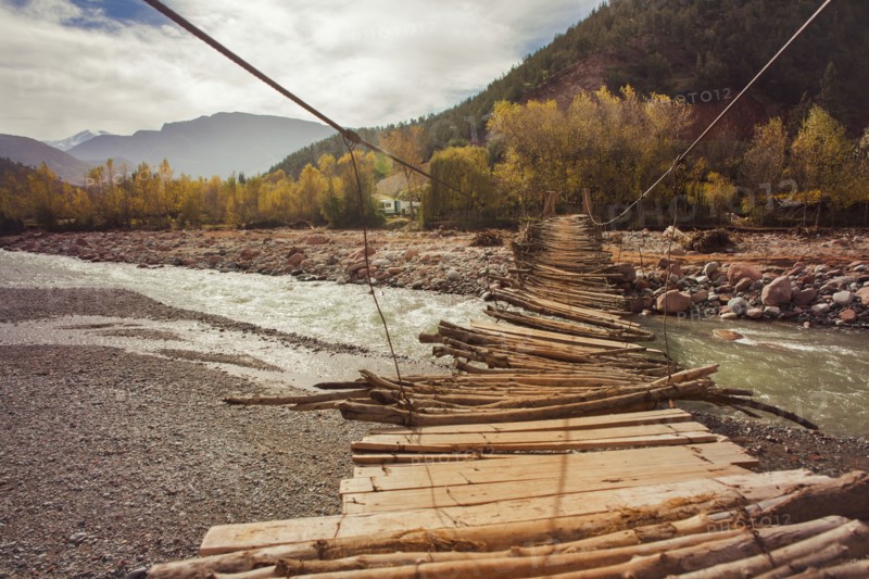 Wooden bridge over remote river