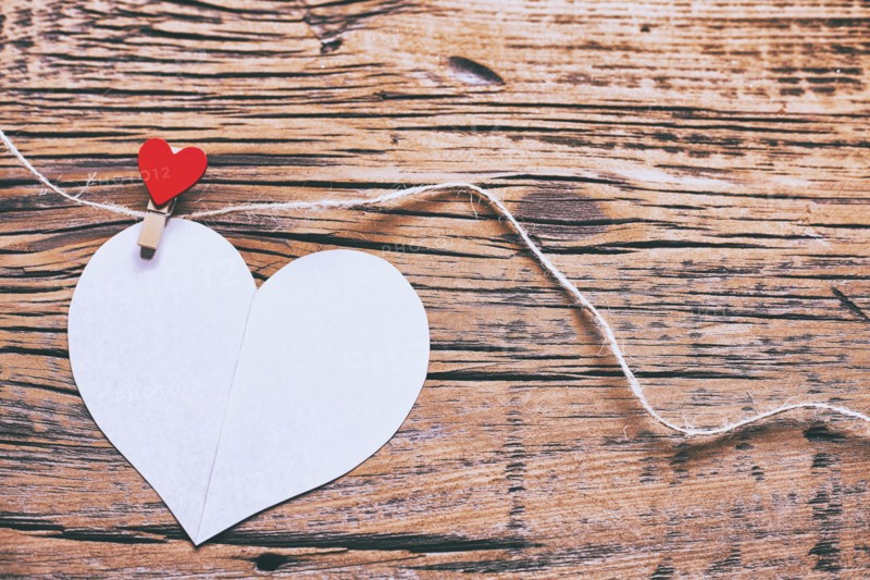 Paper heart hanging on string with clothespin