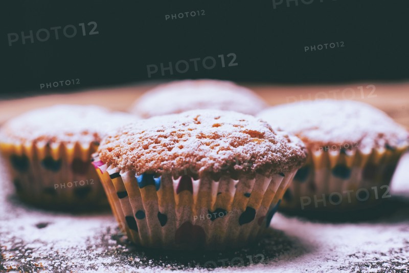 Close up of cupcakes covered with powdered sugar