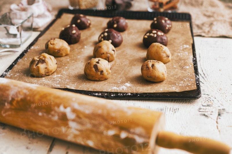 Cookie dough on baking sheet near rolling pin
