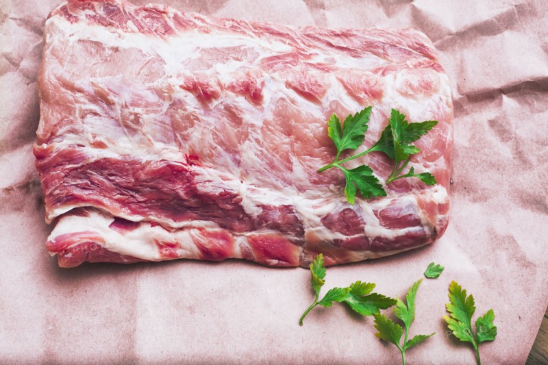 Raw meat and garnish on butcher paper
