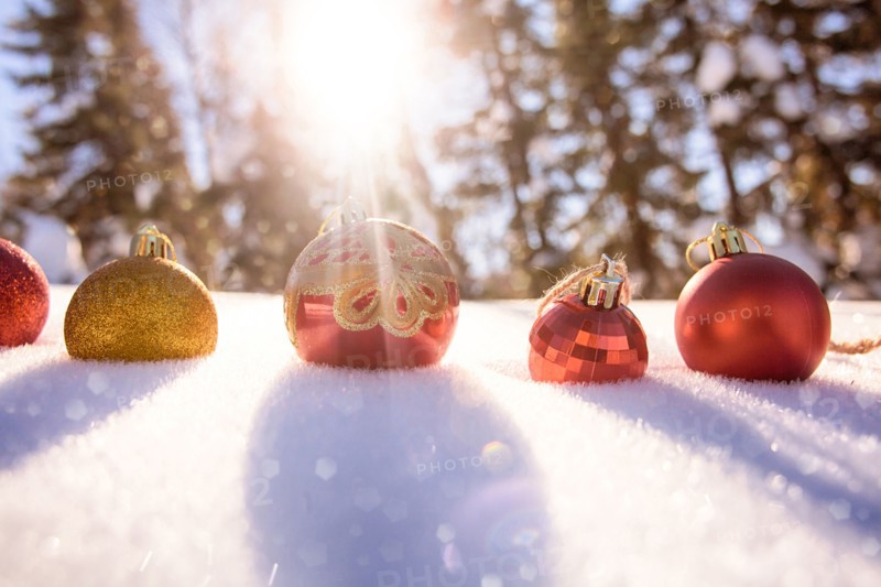 Christmas ornaments in snow