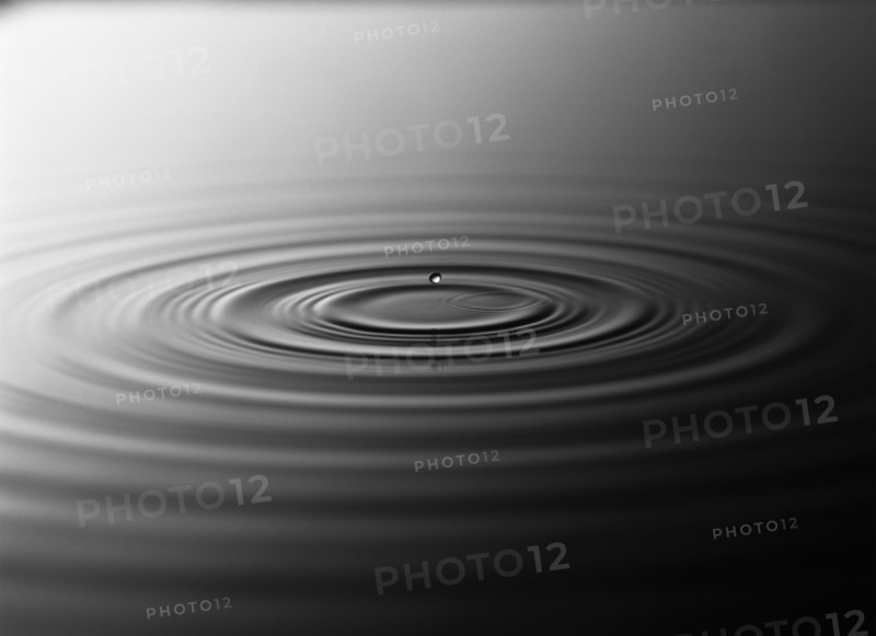 Droplet splashing in rippling water