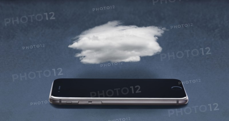 Cloud floating over cell phone