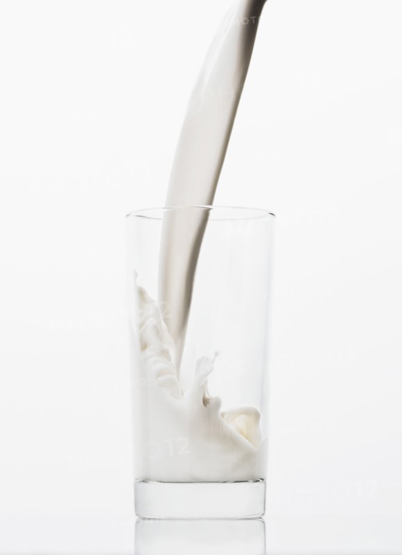 Milk pouring into glass