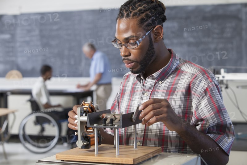 Student performing experiment in science classroom