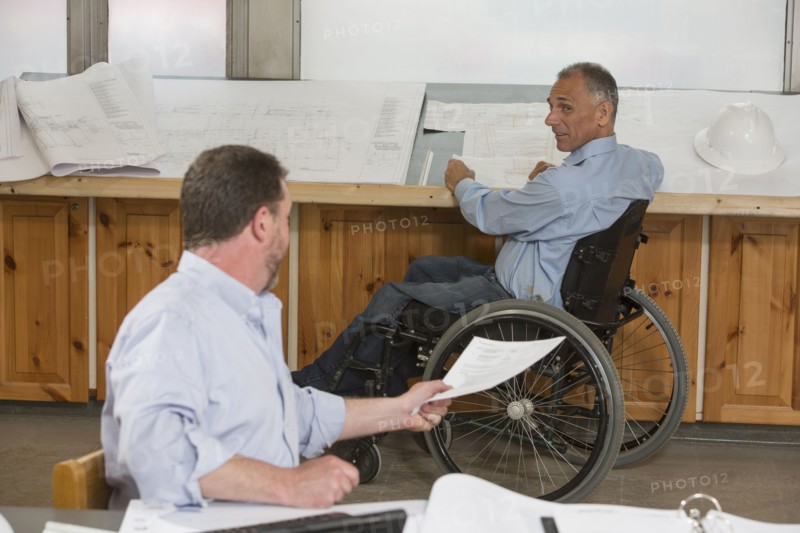 Caucasian architects working in office