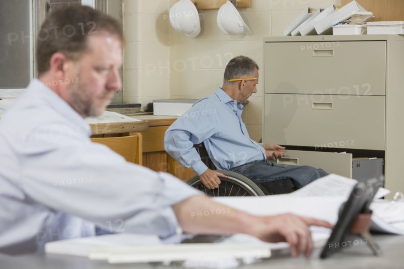 Caucasian architects working in office