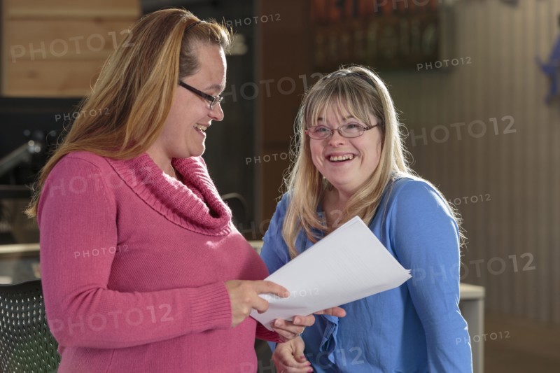 Caucasian businesswomen talking in office