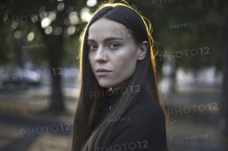 Wind blowing hair of serious Caucasian woman