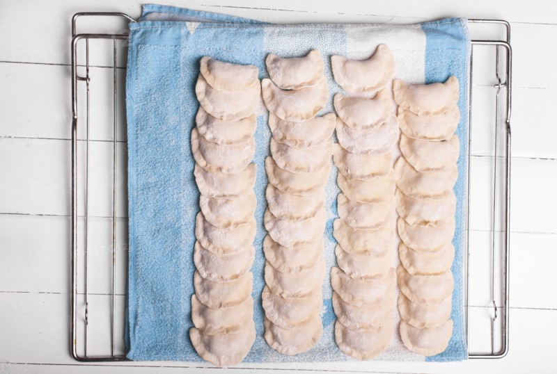Rows of pierogies on towel