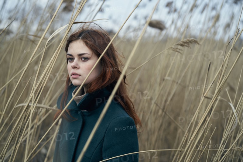 Portrait of serious Caucasian woman standing in field