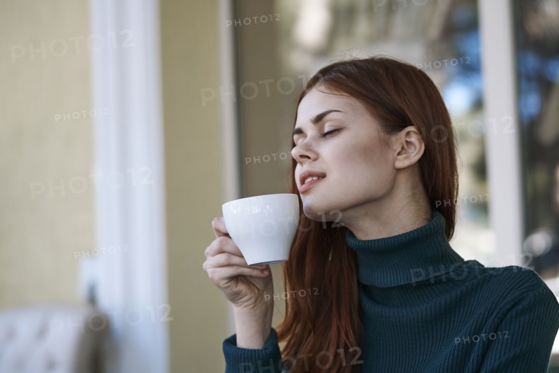 Caucasian woman relaxing and drinking coffee