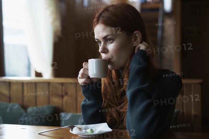 Woman drinking coffee in cafe