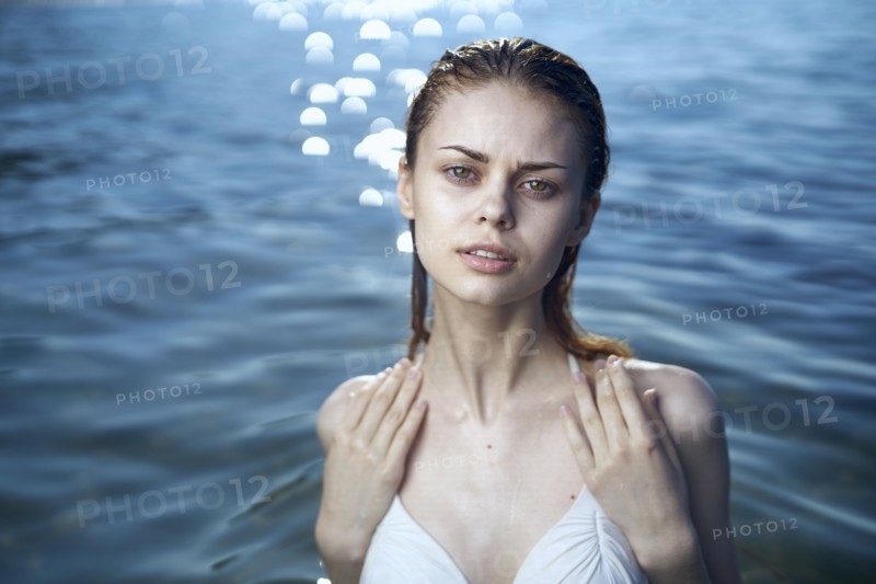 Serious woman wearing a bikini in ocean