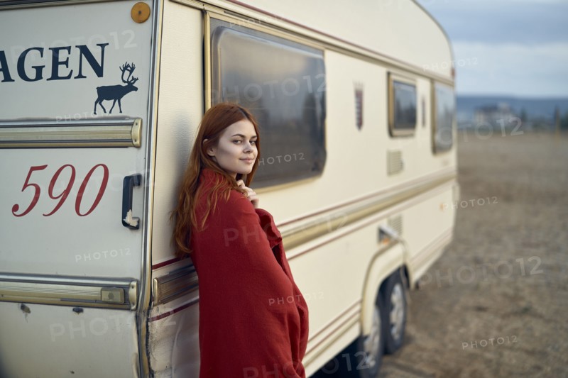 Caucasian woman leaning on motor home