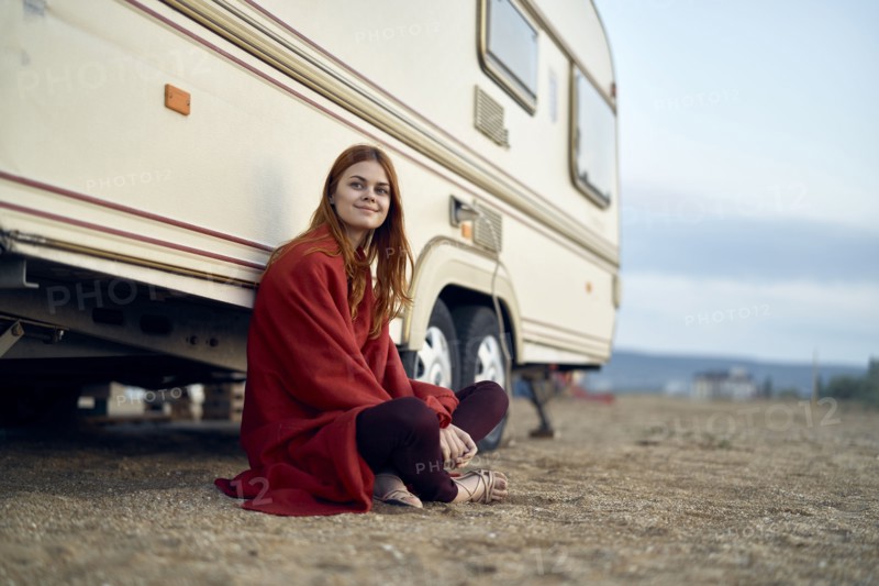 Caucasian woman leaning on motor home