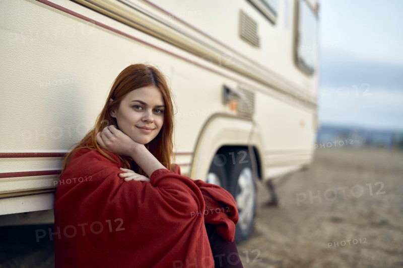 Caucasian woman leaning on motor home