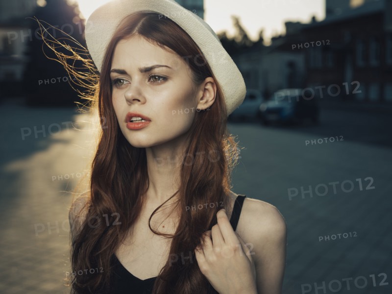 Wind blowing hair of serious Caucasian woman