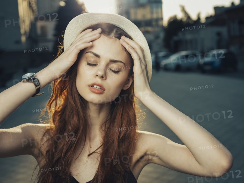 Pensive Caucasian woman with hand in hair