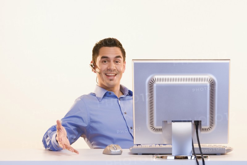 Portrait of businessman at computer