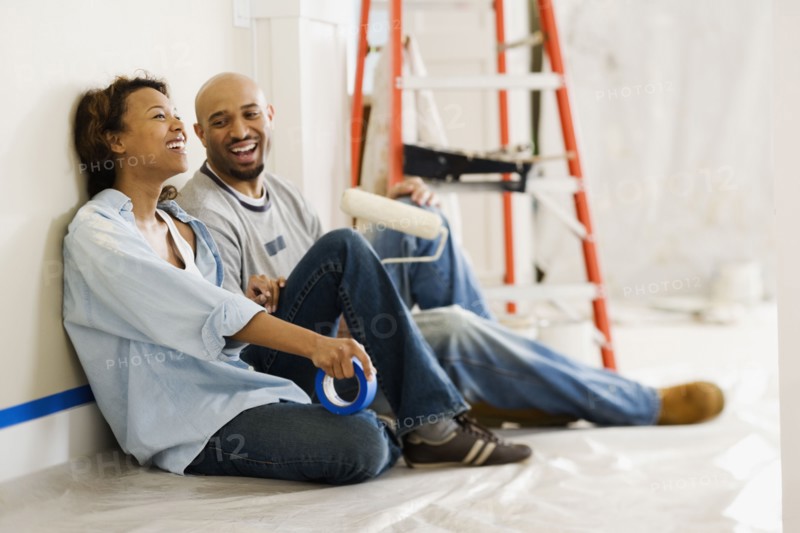 African couple taking break from painting
