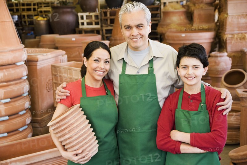 Hispanic family working at garden center