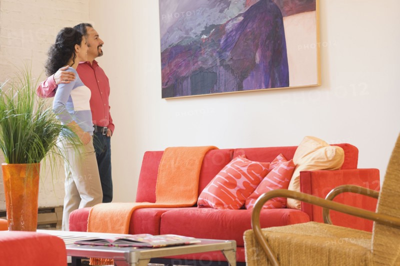 Hispanic couple looking at artwork