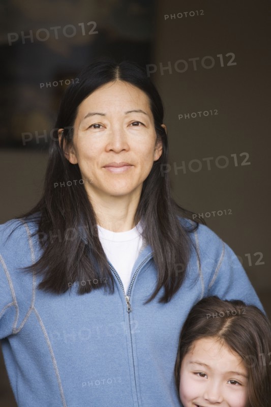 Mixed race mother and daughter smiling