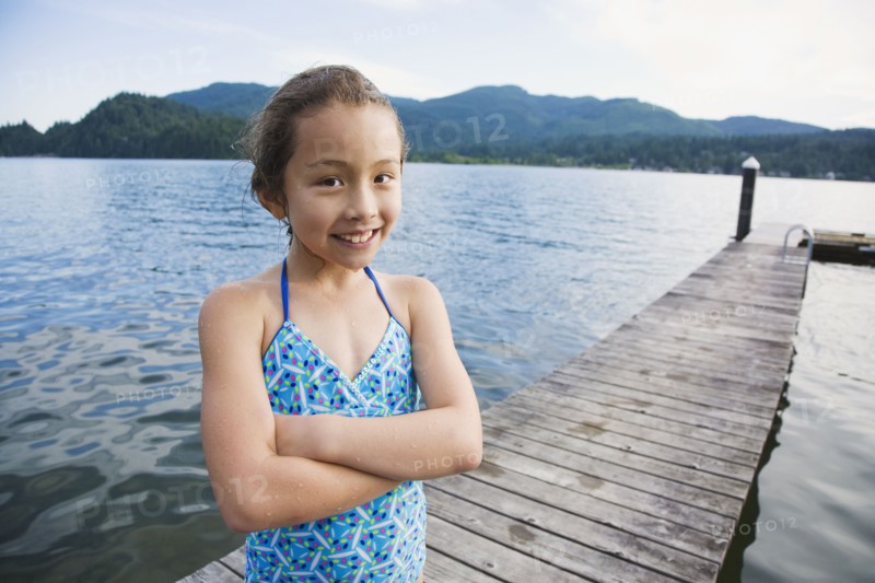 Asian girl standing on dock