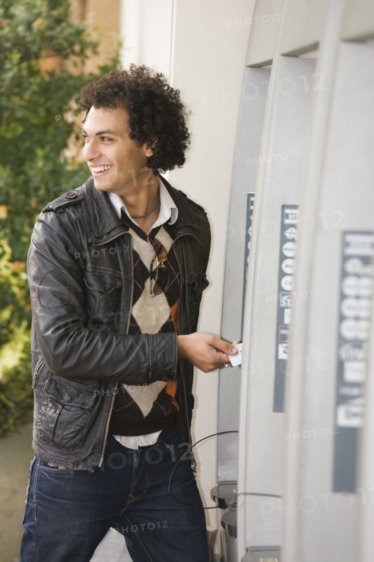 Middle Eastern man at ATM