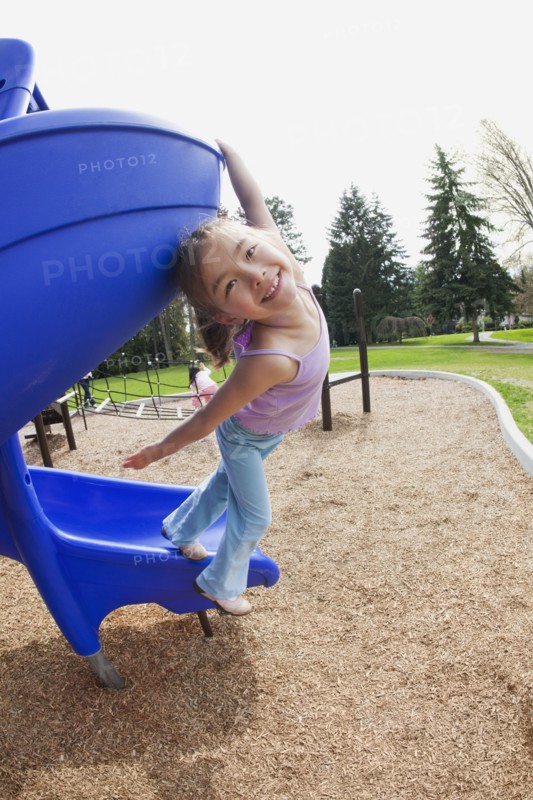 Mixed race girl at playground
