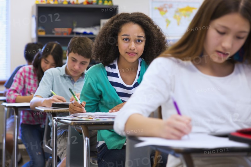 Students taking notes in class